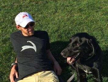 Man and dog on grass